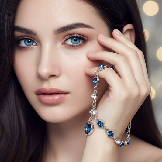 Beautiful blue-eyed model holding Lucky Heart Crystal Bracelet - luxury shot